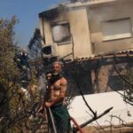 Homes burn in Greece as wildfire sweeps through coastal towns